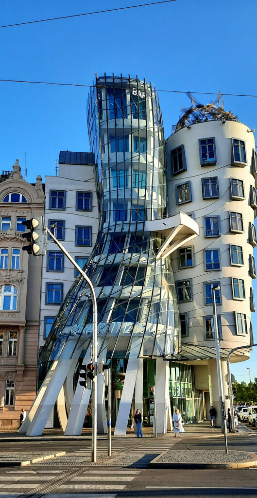 Exterior of Prague's Dancing House, featuring its curved glass tower and distinctive modern architecture.