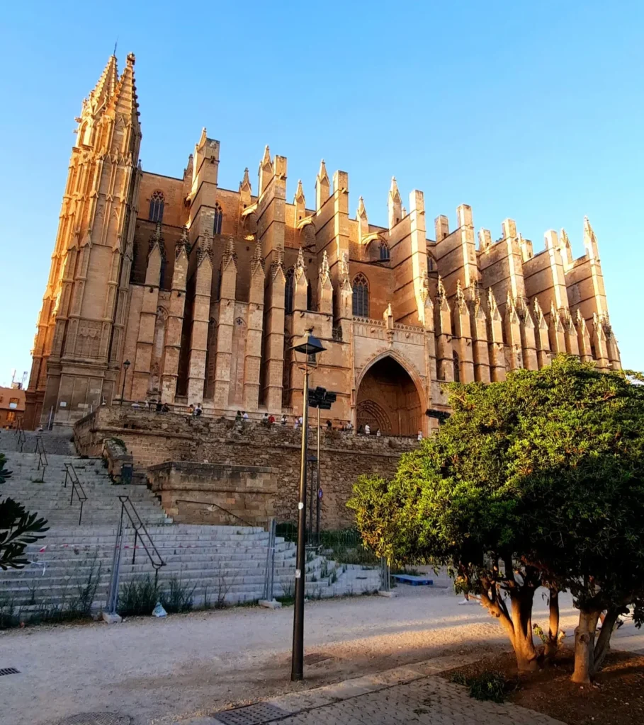 Palma Cathedral in Mallorca illuminated by warm golden evening sunlight